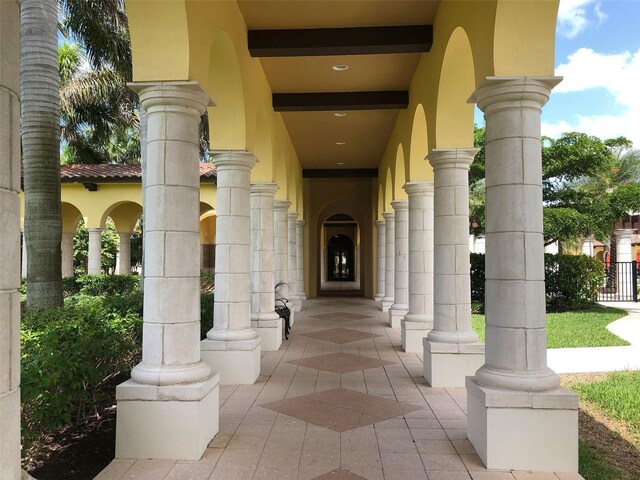 20190 Ragazza Cir Unit 202, Venice, FL 34293 - doorway to property featuring stucco siding and covered porch