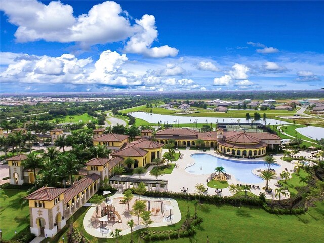 20190 Ragazza Cir Unit 202, Venice, FL 34293 - aerial perspective of suburban area with a nearby body of water and a pool area