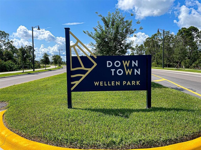 20190 Ragazza Cir Unit 202, Venice, FL 34293 - community / neighborhood sign featuring a yard