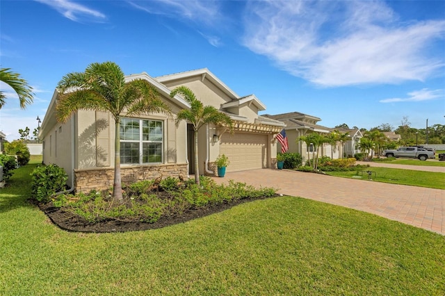 view of front of house with a garage and a front lawn