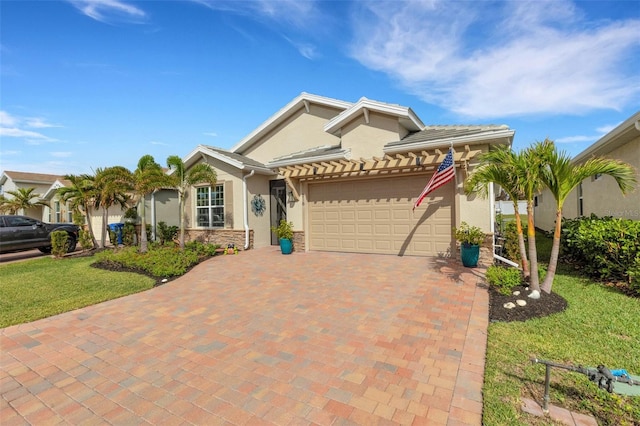 view of front of home featuring a garage and a front yard