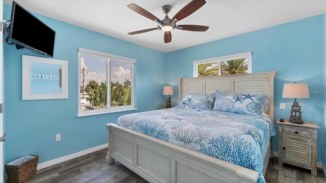 bedroom featuring ceiling fan and dark wood-type flooring