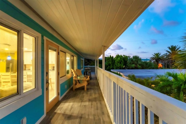 view of balcony at dusk