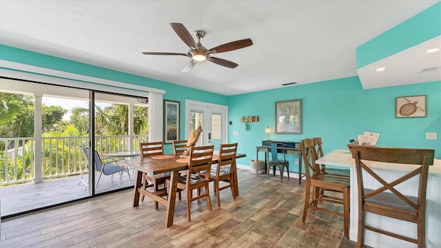 dining room featuring ceiling fan and wood-type flooring