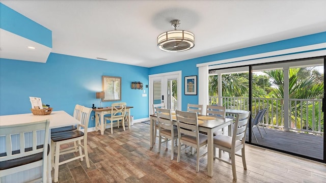 dining room with wood-type flooring