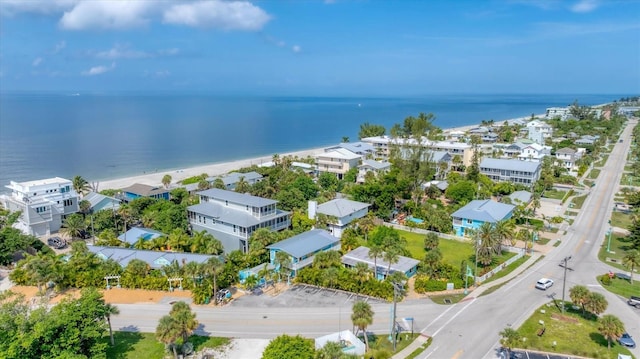 bird's eye view with a water view and a view of the beach