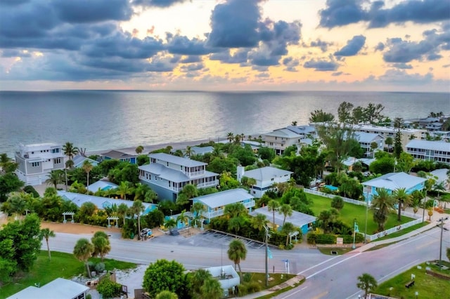 aerial view at dusk with a water view