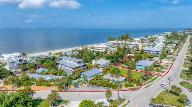 aerial view featuring a view of the beach and a water view