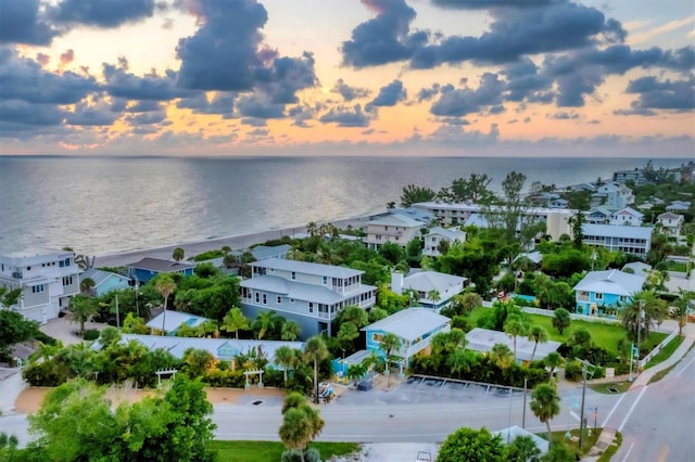 aerial view at dusk with a water view