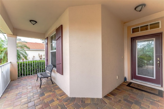 entrance to property with covered porch