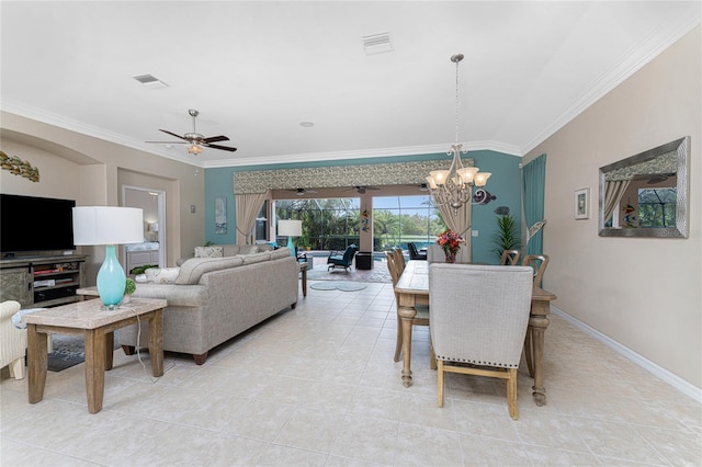 tiled dining area with vaulted ceiling, ceiling fan with notable chandelier, and ornamental molding