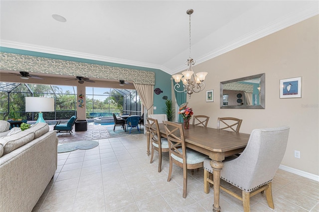 dining room with lofted ceiling, light tile patterned flooring, a notable chandelier, and ornamental molding