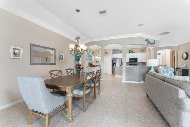 dining area featuring light tile patterned flooring, crown molding, and an inviting chandelier