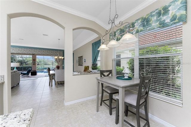 105 Treviso Ct, North Venice, FL 34275 - dining room featuring a chandelier, ornamental molding, baseboards, light tile patterned flooring, and arched walkways