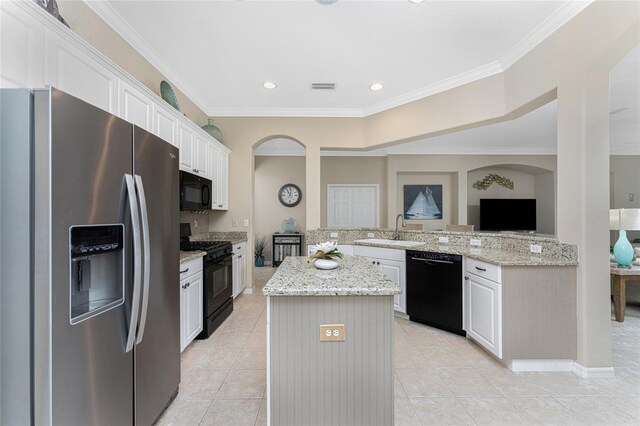 105 Treviso Ct, North Venice, FL 34275 - kitchen featuring black appliances, a sink, a kitchen island, light tile patterned floors, and ornamental molding