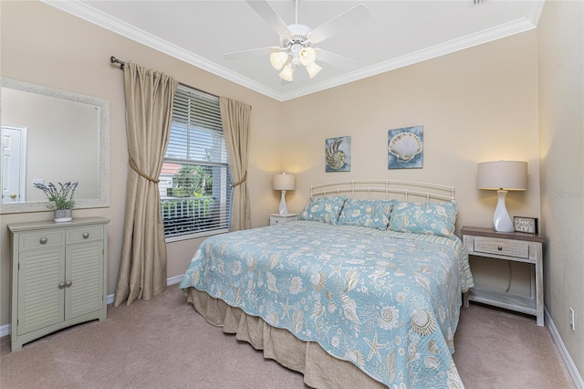 carpeted bedroom featuring ceiling fan and ornamental molding