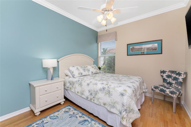 bedroom with light hardwood / wood-style floors, ceiling fan, and ornamental molding