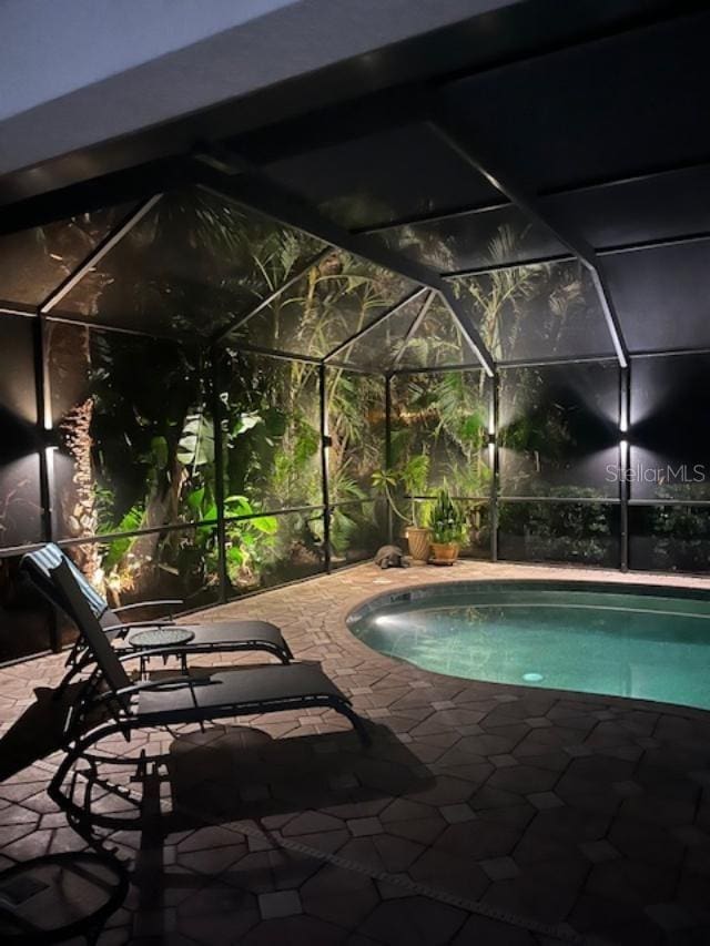 105 Treviso Ct, North Venice, FL 34275 - swimming pool featuring a patio area and glass enclosure
