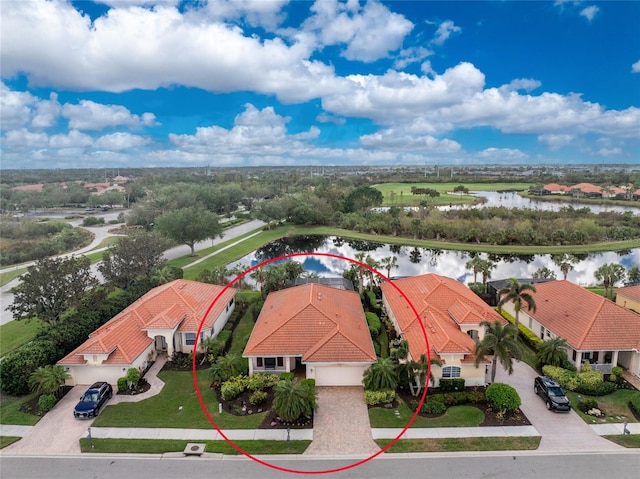 birds eye view of property with a water view