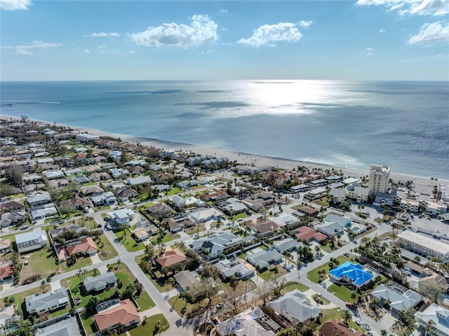 bird's eye view featuring a view of the beach and a water view