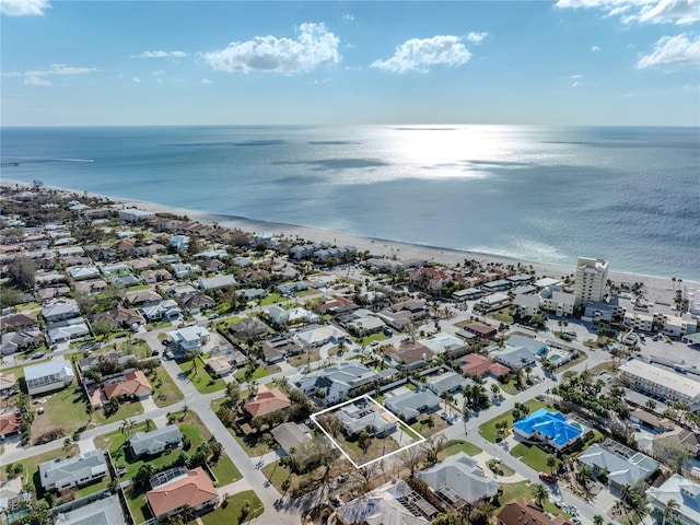 birds eye view of property featuring a water view and a view of the beach