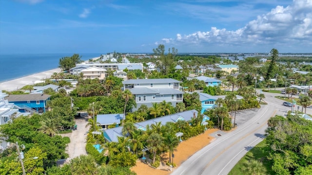 bird's eye view featuring a water view and a view of the beach