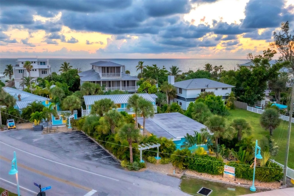 aerial view at dusk with a water view