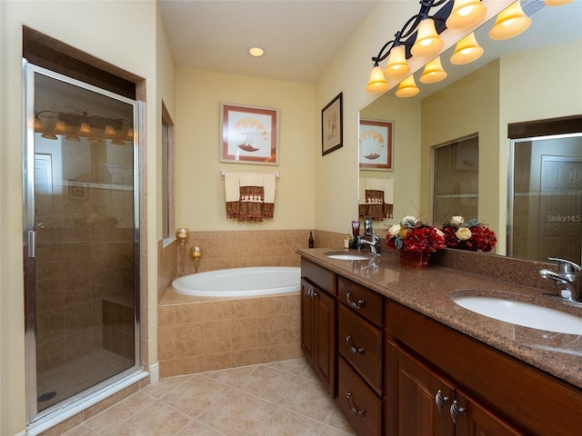 bathroom with tile patterned flooring, vanity, and independent shower and bath