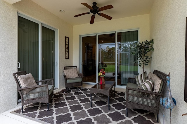 view of patio featuring ceiling fan