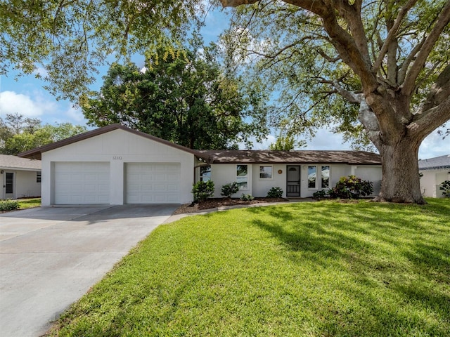 ranch-style house with a front yard and a garage