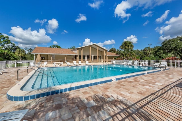 view of swimming pool featuring a patio area