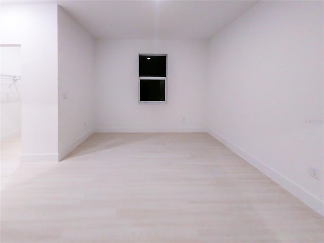 spare room featuring light wood-type flooring