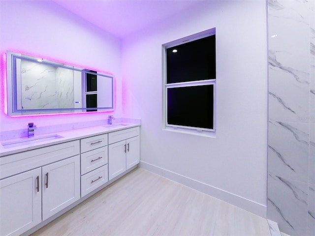 bathroom featuring vanity and hardwood / wood-style flooring