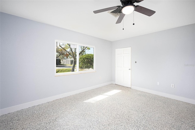 carpeted empty room with ceiling fan