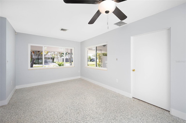 unfurnished room featuring ceiling fan