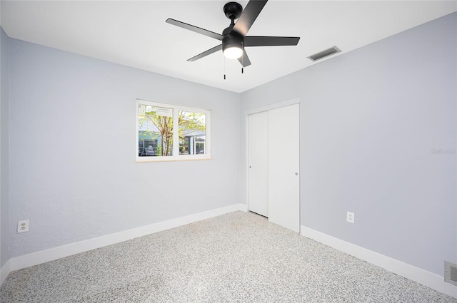 unfurnished bedroom featuring a closet, carpet, and ceiling fan