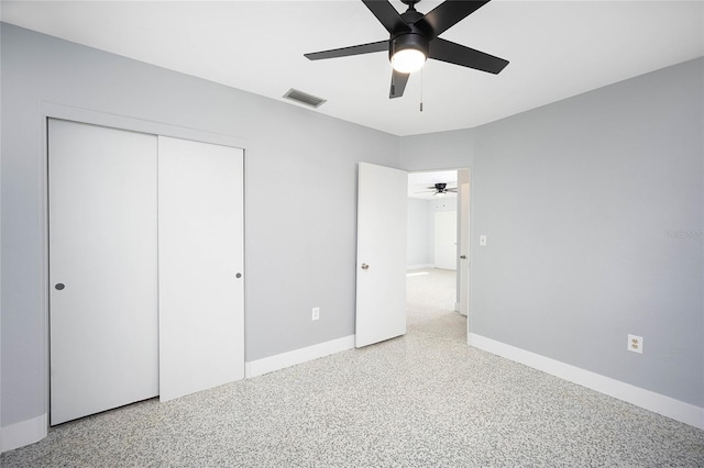 unfurnished bedroom featuring a closet and ceiling fan