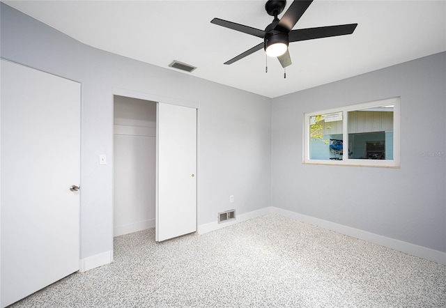 unfurnished bedroom with ceiling fan and carpet floors