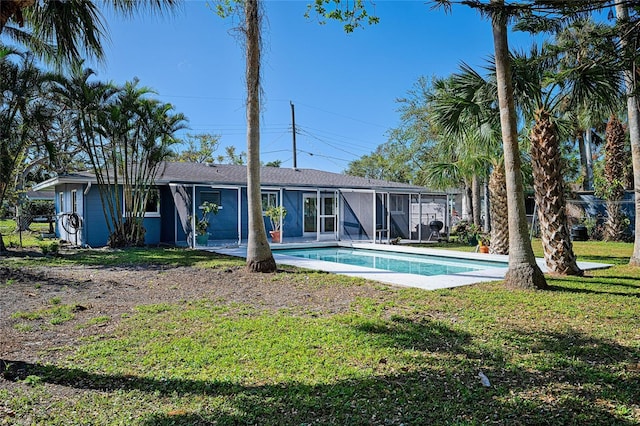 rear view of house with a yard