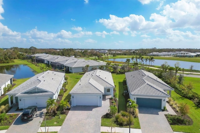 birds eye view of property with a water view