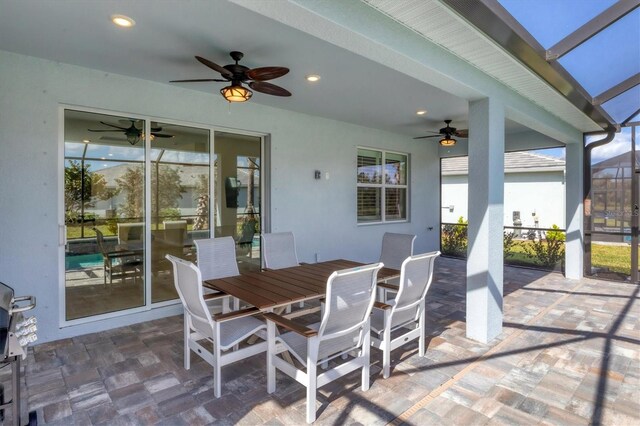 view of patio / terrace featuring a lanai and ceiling fan