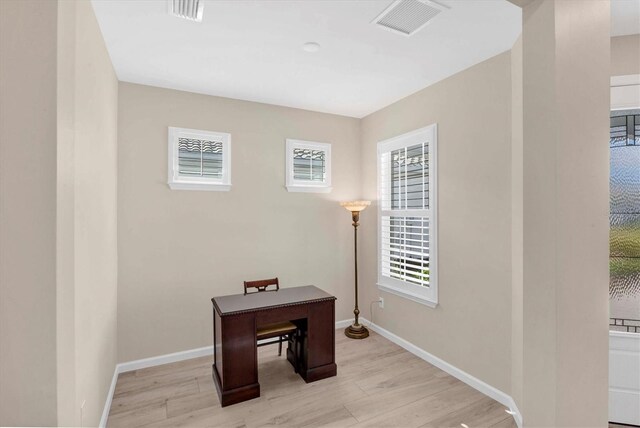 home office featuring light hardwood / wood-style floors