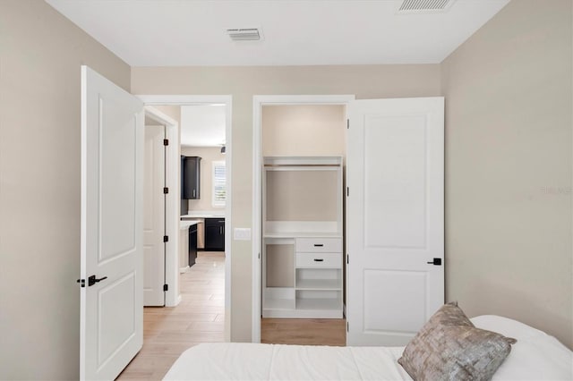 bedroom featuring a closet and light hardwood / wood-style floors