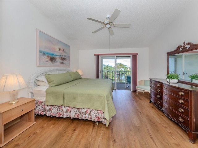 bedroom with ceiling fan, light hardwood / wood-style floors, a textured ceiling, and access to outside