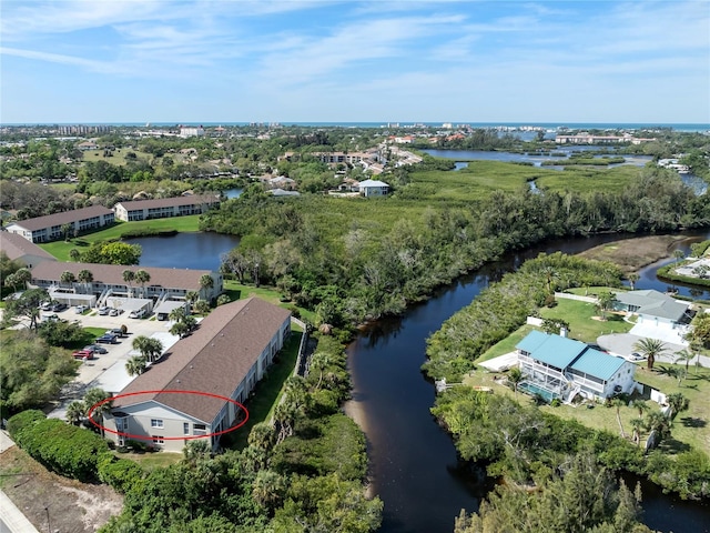 birds eye view of property featuring a water view