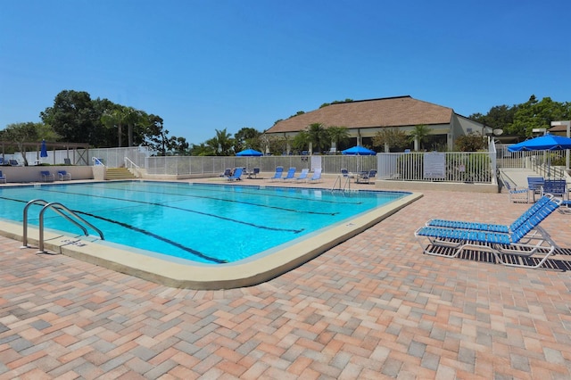 view of swimming pool with a patio area