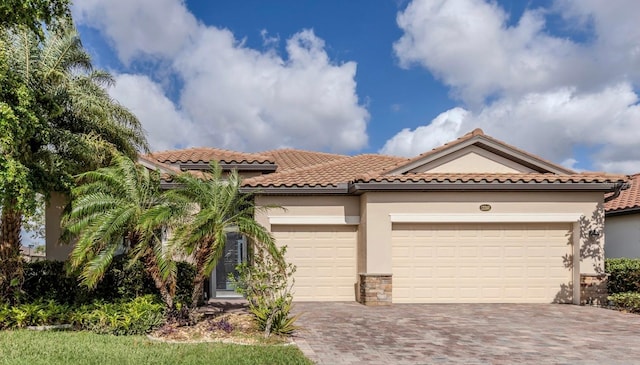 mediterranean / spanish-style house featuring a garage