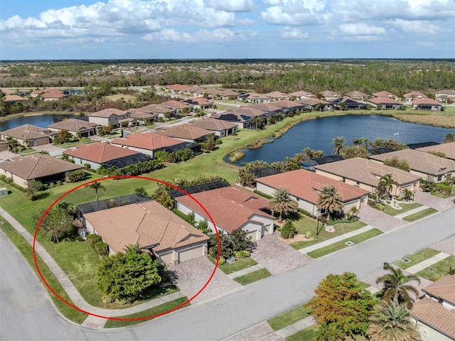 birds eye view of property with a water view