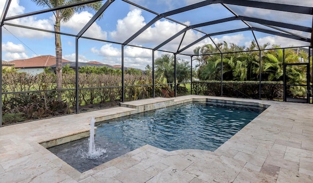 view of pool with a patio area and a lanai