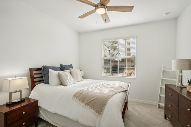 bedroom with light tile patterned floors and ceiling fan